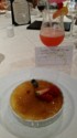 Tropical drink, creme brulee, and reservation for a massage